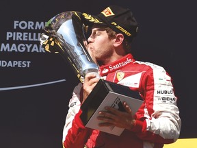 Ferrari's Sebastian Vettel celebrates after winning the Hungarian Grand Prix on Sunday. (AFP)