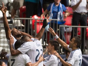 Vancouver Whitecaps FC's Kendall Waston, centre, celebrates his goal against the San Jose Earthquakes during the first half of MLS soccer action in Vancouver, B.C., on Sunday, July 26, 2015. (THE CANADIAN PRESS/Jonathan Hayward)
