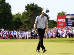 Canadian David Hearn reacts to a missed putt on the 18th green during the final round of the RBC Canadian Open at Glen Abbey Golf Club on July 26, 2015 in Oakville, Canada. (Cliff Hawkins/Getty Images/AFP)