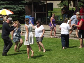 Jim Moodie/The Sudbury Star
It's Your Birthday attendees bust some moves despite the heat on Sunday, while the Tremonics provide the music.