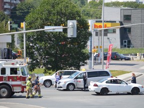 Jim Moodie/The Sudbury Star
Firefighters and paramedics respond to a two-vehicle collision on Paris Street at Centennial Drive, near the entrance to Health Sciences North, on Sunday afternoon.