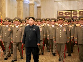 North Korean leader Kim Jong Un visits the Kumsusan Palace of the Sun where the statues of President Kim Il Sung and leader Kim Jong Il are standing during the 62nd anniversary of the end of the Korean War in this undated photo released by North Korea's Korean Central News Agency (KCNA) in Pyongyang July 27, 2015. (REUTERS/KCNA)