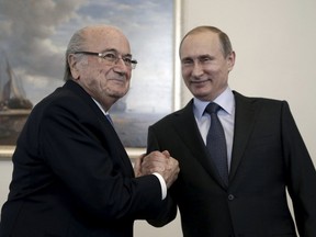 Russian President Vladimir Putin (R) shakes hands with FIFA president Sepp Blatter during a meeting in St. Petersburg, Russia, July 25, 2015. 
(REUTERS/Maxim Shipenkov/Pool)