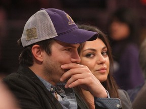 Ashton Kutcher and Mila Kunis are not impressed with Britain's Daily Mail newspaper over pictures they published of their baby daughter Wyatt. (WENN.COM)
