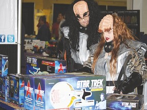 Klingons K’lay Ar’dur and Akiel taiDaw browse for Star Trek merchandise at one of the many vendor booths at the Vulcan District Arena on Saturday during the first day of Vul-Con 2015.