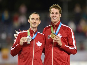Canadians, gold medal winner Derek Drouin, right, and silver medal winner Mike Mason celebrate after the men's high jump final at the 2015 Pan Am Games in Toronto on Saturday, July 25, 2015. THE CANADIAN PRESS/Frank Gunn
