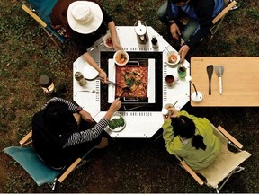 For eating around the fire in style MEC has the Snow Peak fire ring table ($345).