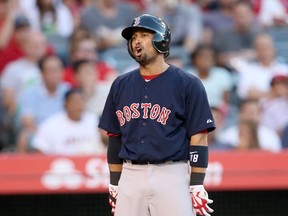Shane Victorino of the Boston Red Sox reacts after being called out on strikes in the second inning against the Los Angeles Angels of Anaheim at Angel Stadium on July 17, 2015. (Stephen Dunn/Getty Images/AFP)