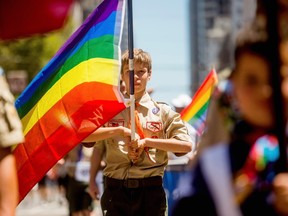Boy Scout Casey Chambers carries a rainbow flag during the San Francisco Gay Pride Festival in California in this June 29, 2014 file photo. REUTERS/Noah Berger/Files