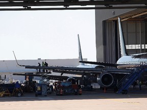 Authorities are investigating how a man was able to board a plane at Dallas/Fort Worth International Airport without a ticket on Monday. REUTERS/Tim Sharp