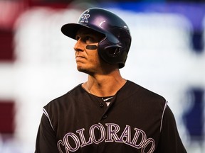Troy Tulowitzki of the Colorado Rockies reacts after flying out in the seventh inning of a game against the Cincinnati Reds at Coors Field on July 25, 2015. (Dustin Bradford/Getty Images/AFP)