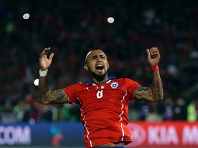 Chile's Arturo Vidal celebrates after scoring a penalty during penalty shootout at the Copa America final soccer match against Argentina at the National Stadium in Santiago, Chile, Saturday, July 4, 2015. Chile won the Copa America on penalty shootout.(AP Photo/Natacha Pisarenko)