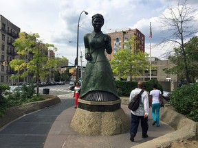 This June 25, 2015 photo shows a statue of Harriet Tubman in the Harlem section of New York. The neighborhood's African-American history, art, architecture and other attractions make it a compelling destination for tourists. (AP Photo/ Beth J. Harpaz)