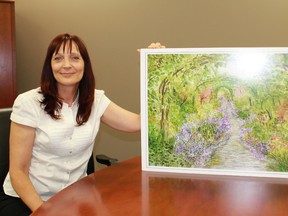 Lambton Mosaic Project coordinator Kathryn Evans holds up a print of one of her exquisite watercolour paintings. The Lambton Mosaic Project is an initiative seeking out artwork from local community members in an effort to promote the county's vast cultural and literary richness, in time for Canada's 150th birthday in 2017.
CARL HNATYSHYN/SARNIA THIS WEEK