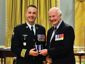 Lt.-Col. Mason Stalker (left) pictured with Governor General David Johnston, has been charged with 10 sex-related offences he allegedly committed while acting as a mentor to an Edmonton-based cadet group. Photo by MCpl Dany Veillette, Rideau Hall