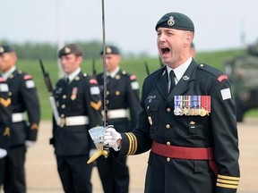Lt.-Col. Mason Stalker commands his troops at the 1 PPCLI Change of Command Parade in Edmonton, Aug.14, 2014. Stalker faces serious, sex-related charges involving allegations that stem from the mentoring of military cadets. THE CANADIAN PRESS/HO-Department of National Defence/ Master Cpl. Tina Gillies