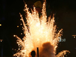 Former Canadian basketball player Steve Nash looks on after lighting the cauldron during the opening ceremony for the Pan Am Games in Toronto, Friday, July 10, 2015. AP Photo/Gregory Bull