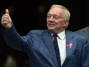 Owner Jerry Jones of the Dallas Cowboys gives the ‘thumbs up’ to some fans before the game against the Seattle Seahawks at CenturyLink Field on October 12, 2014 in Seattle. (Steve Dykes/Getty Images/AFP)