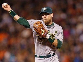 Ben Zobrist of the Oakland Athletics throws to first base during MLB play against the San Francisco Giants at AT&T Park on July 24, 2015 in San Francisco. (Lachlan Cunningham/Getty Images/AFP)