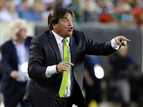 Mexico head coach Miguel Herrera yells during the first half of the CONCACAF Gold Cup championship soccer match against Jamaica, Sunday, July 26, 2015, in Philadelphia. (AP Photo/Matt Rourke)