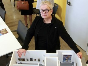 Lisa Daniels, curator and director of the Judith and Norman Alix Art Gallery, is shown displaying a model of how the Masterworks from the Beaverbrook Art Gallery exhibit will be set up at the Sarnia facility. The gallery is closing Aug. 4-Oct. 2 so staff and volunteers can prepare. (File photo/Sarnia Observer/Postmedia Network)