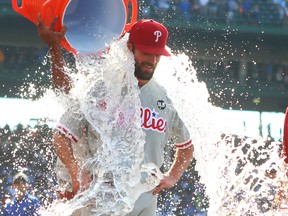 Philadelphia Phillies pitcher Cole Hamels is doused with water after throwing a no-hitter against the Chicago Cubs at Wrigley Field. (Caylor Arnold/USA TODAY Sports)