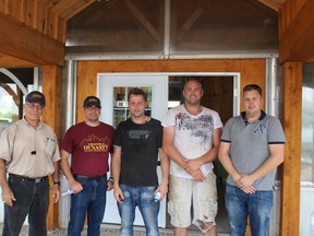 Hannibal Muhtar, Andrew Muhtar, Rob Visscher, Bernhard Visscher and Alex Visscher (left to right). The Visscher brothers opened up their farm to visiting agricultural researchers on July 28. (MEGAN STACEY/Sentinel-Review)
