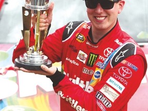 Kyle Busch celebrates after winning the Crown Royal Presents The Jeff Kyle 400 At The Brickyard on Sunday. (AFP)