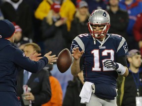 New England Patriots quarterback Tom Brady has a ball tossed to him during warmups before the AFC Championship game against the Indianapolis Colts in Foxborough, Mass. (AP Photo/Matt Slocum, File)