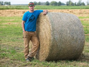 Dairy farmer Andrew Campbell spent the day baling hay in Kerwood, Ont. on Tuesday. (DEREK RUTTAN, The London Free Press)