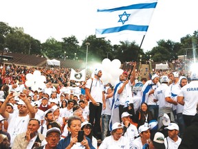 Israeli team athletes arrive for the opening ceremony of the 14th European Maccabi Games in Berlin on Tuesday. It’s the first time these Games have been held in Germany — seven decades after Adolf Hitler sought to ban Jews from competing in the 1936 Olympics. (Reuters)