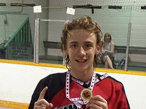 Submitted photo: Wallaceburg's Tanner Cole holds up his medal after he lead Team Ontario to gold at the Canadian bantam box lacrosse championship.