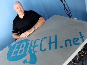 John Hollingsworth with Electro-Byte Technologies Inc. poses for a photo at the internet service provider's Sarnia office Wednesday. Coming up on its 21st anniversary as a business, EBTech is closing its doors. 
(Tyler Kula, The Observer)