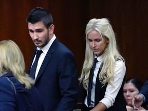 Kings defenceman Slava Voynov enters Superior Court with his wife, Marta Varlamova, on Thursday July 2, 2015 in Torrance, Calif. Voynov pleaded no contest to a misdemeanor domestic charge and was sentenced to 90 days in jail. (Brad Graverson/The Daily Breeze via AP)
