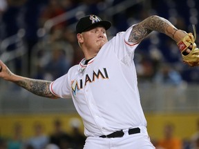 Mat Latos of the Miami Marlins pitches during a game against the St. Louis Cardinals at Marlins Park on June 24, 2015 in Miami. (Mike Ehrmann/Getty Images/AFP)