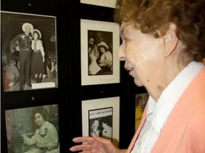 Sarah Hyatt/The Intelligencer
Freda Turcotte, 86 and blind, shows some of her favourite pictures of her and singers like Hank Snow and Hank Wililams at her Belleville home Wednesday. Her CNIB Vision Mate program volunteer helped her with the photos that are precious to her. CNIB is recruiting volunteers.