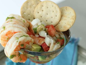 This July 13, 2015 photo shows grilled shrimp margarita with avocado and summer tomatoes in Concord, N.H. This dish is from a recipe by Elizabeth Karmel. (AP Photo/Matthew Mead)