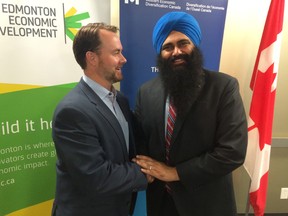 Conservative Minister Tim Uppal shakes hands with Edmonton Economic Development Corporation President Brad Ferguson in Edmonton on Wednesday, July 29, 2015. Matt Dykstra/Edmonton Sun