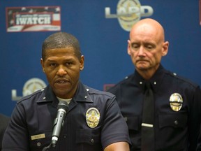 Los Angeles Police Department Deputy Chief Bill Scott, left, told the L.A. Times that the apparent challenge between rival L.A. gangs to kill 100 people in 100 days has ordinary people scared. REUTERS/Mario Anzuoni