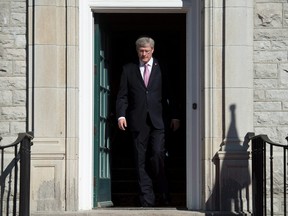 Prime Minister Stephen Harper steps out of his residence at 24 Sussex drive Monday June 9, 2014 in Ottawa. It's not just political parties that will be spending money hand over fist if Harper fires the starting gun for the Oct. 19 federal election weeks earlier than necessary. THE CANADIAN PRESS/Adrian Wyld
