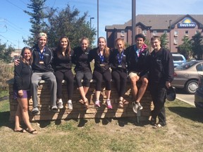 Kingston Aeros members, from left, coach Liz Campbell, Brent Rowlatt, Addie Kaiser, Julia Foster, Mckaylie Campbell, Clare Stafford, Soren Hertz and head coach Graeme Huffman in Calgary, which hosted the national trampoline championships. (Supplied photo)