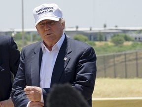 Republican presidential candidate Donald Trump attends a news conference near the U.S.-Mexico border (background), outside Laredo, Texas July 23, 2015. REUTERS/Rick Wilking