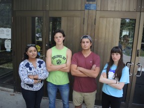 Grade 12 students, from left, Mariyam Qureshi, Jay Zhao-Murray, John Kontogiannis and Caroline Beddoe stand in front of Colonel By Secondary School. The students organized a mass walk-out this September, to protest the withdrawal of extracurricular activities in schools. (Julienne Bay/Ottawa Sun)