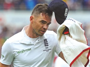England’s James Anderson tips his cap after getting six wickets against Australia yesterday. (AP)