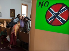 Community members, concerned about the use of the Confederate flag, gather at the Cornwallis Street Baptist Church in Halifax on Wednesday, July 29, 2015. Nova Scotian Citizens Against White Supremacy say the flag is a symbol of racism and displaying it publicly should be considered a hate crime. THE CANADIAN PRESS/Andrew Vaughan
