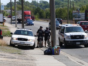 Greater Sudbury Police were dispatched to Lorne Street in Sudbury, Ont. on Wednesday July 29, 2015 after getting word that an individual with an outstanding warrant was identified in the area. Police dispersed after the suspect was unable to be located. The individual is still at large. John Lappa/Sudbury Star/Postmedia Network