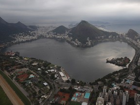 This July 27, 2015 aerial photo shows the Rodrigo de Freitas Lake in Rio de Janeiro, Brazil. An Associated Press analysis of water quality found dangerously high levels of viruses and bacteria from human sewage in Olympic and Paralympic venues. The Rodrigo de Freitas Lake, which was largely cleaned up in recent years, was thought be safe for rowers and canoers. Yet AP tests found its waters to be among the most polluted for Olympic sites. (AP Photo/Leo Correa)