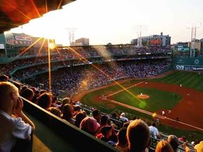 Fans -- none of which puked, as far as we know -- take in a game at Boston's Fenway Park. (AFP)