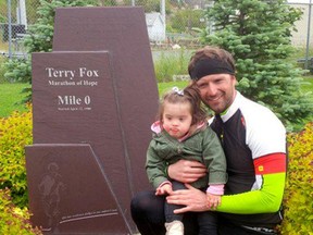 PHOTO COURTESY NICK FOLEY
Nick Foley and his daughter, Brynn, stand at the Terry Fox memorial in St. John's, NFLD where Foley wrapped up his cross-country cycling trip this past weekend.
