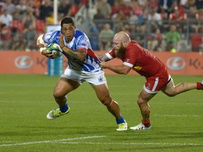 Samoa's Anthony Perenise escapes a tackle by Canada's Ray Barkwill during the first half of their Pacific Nations Cup rugby match in Toronto on Wednesday, July 29, 2015. (Jon Blacker/THE CANADIAN PRESS)